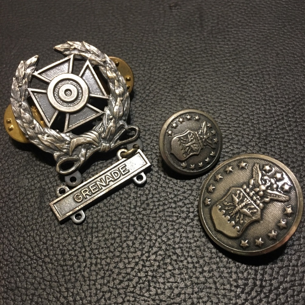 Military memorabilia buttons and pins
